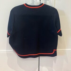 Red Valentino black scuba top with coral trim